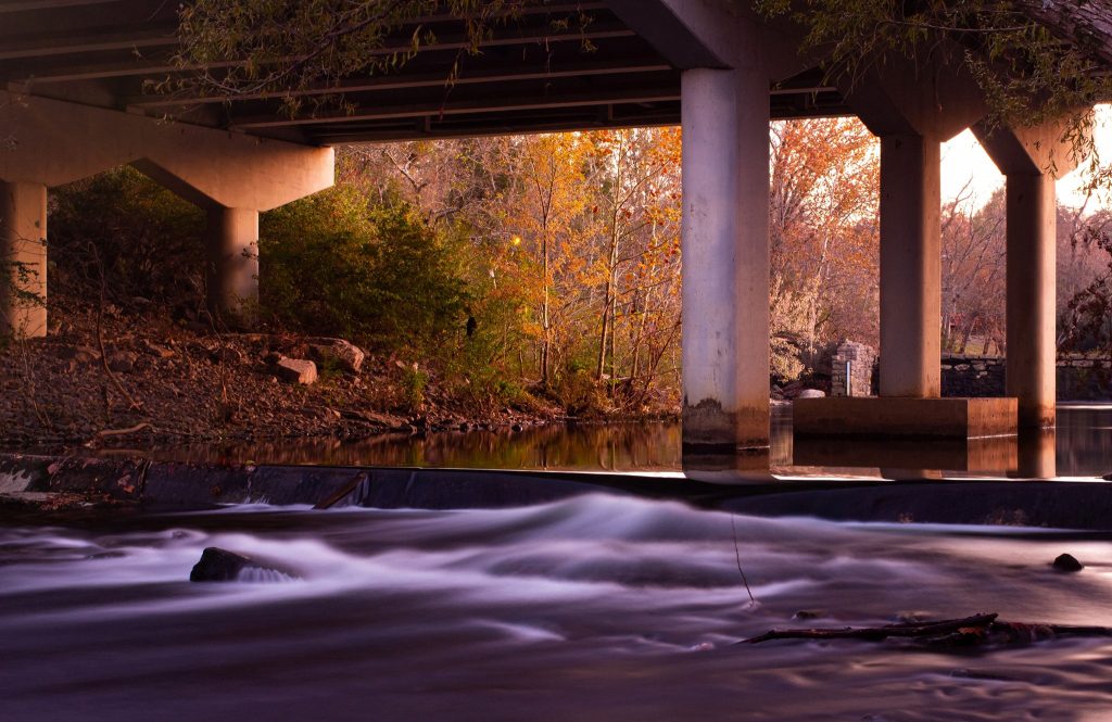 image of the river under a bridge